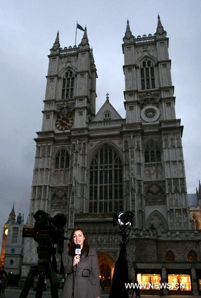 A reporter does live broadcast in front of the Westminster Abbey in London, Britain, Nov. 23, 2010. Prince William and his fiancée Kate Middleton will marry on April 29, 2011 at Westminster Abbey, the historic London church where the funeral of his mother Diana was held in 1997. [Xinhua]