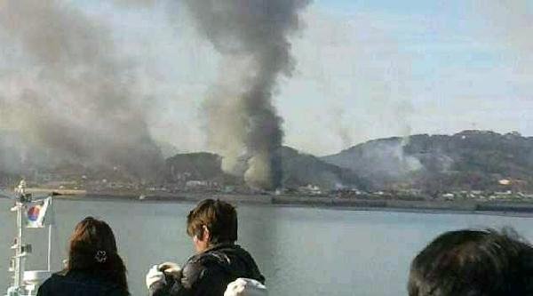 Smoke is seen at Yeonpyeong island near the border against the Democratic People's Republic of Korea (DPRK), in South Korea, Tuesday, Nov. 23, 2010. [Xinhua]