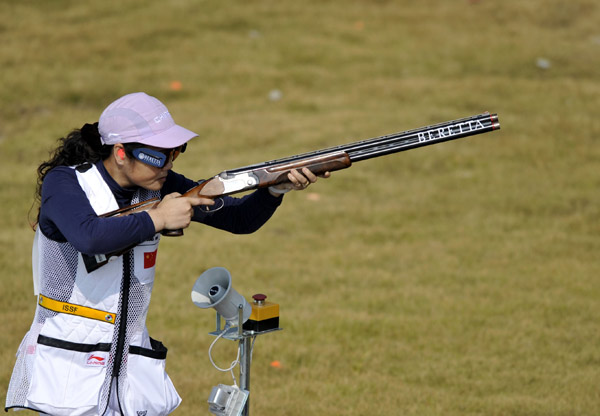Zhang Shan of China shoots during the competition of Women's Skeet Team of shooting at the 16th Asian Games in Guangzhou, south China's Guangdong Province, Nov. 23, 2010. The team of China claimed the title. (Xinhua/Chen Yehua) 