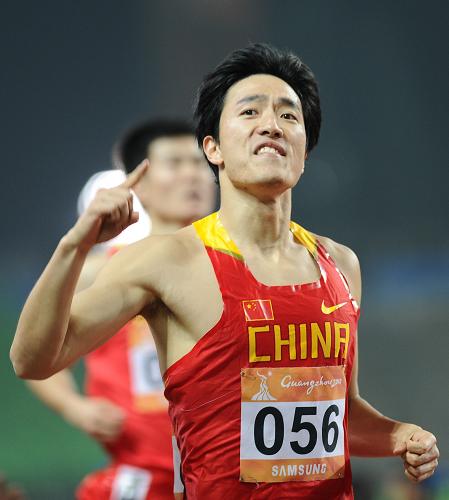 China's Liu Xiang reacts after the men's 110m hurdles heat at the 16th Asian Games in Guangzhou, south China's Guangdong province, Nov. 22, 2010. [Xinhua] 