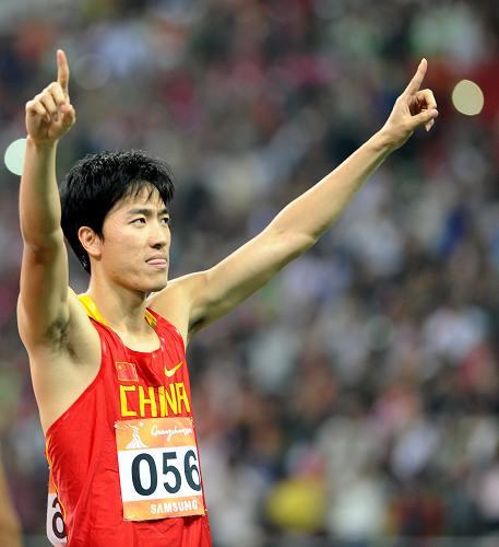 China's Liu Xiang celebrates after the men's 110m hurdles final at the 16th Asian Games in Guangzhou, south China's Guangdong province, Nov. 24, 2010. [Xinhua]