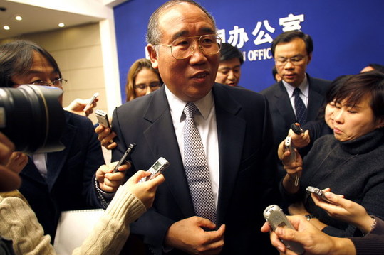 Xie Zhenhua, deputy head of the National Development and Reform Commission, answers questions after the press conference in Beijing on Tuesday. [China Daily]
