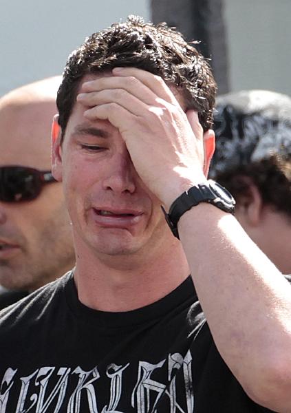 A family member of a miner trapped underground in the Pike River coal mine reacts after learning of a second explosion in the mine at a briefing by mine authorities and police in Greymouth on New Zealand&apos;s west coast November 24, 2010. [Xinhua/Reuters]