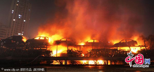 A truck loaded with 20 new cars caught fire at about 9:58 pm while en route to Chongqing. The fire ignited all 20 cars and led to explosions of the cars&apos; tires. The accident blocked traffic on the Yichang-Chongqing highway, but no one was killed.Losses were estimated at nearly 3 million yuan. Authorities are investigating the cause of the fire. [CFP]