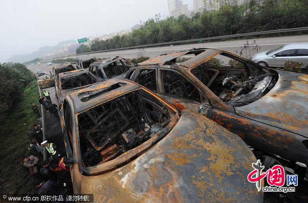 A truck loaded with 20 new cars caught fire at about 9:58 pm while en route to Chongqing. The fire ignited all 20 cars and led to explosions of the cars&apos; tires. The accident blocked traffic on the Yichang-Chongqing highway, but no one was killed.Losses were estimated at nearly 3 million yuan. Authorities are investigating the cause of the fire. [CFP]