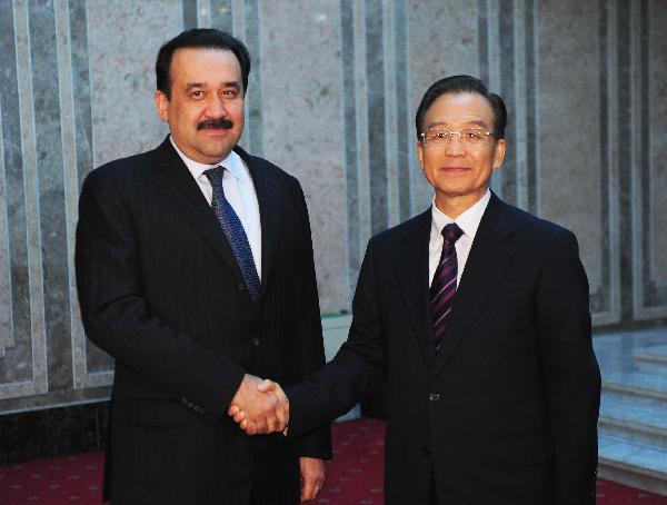 Chinese Premier Wen Jiabao (R) meets with Kazakh Prime Minister Karim Masimov in Dushanbe, capital of Tajikistan, Nov. 24, 2010. [Zhang Duo/Xinhua] 