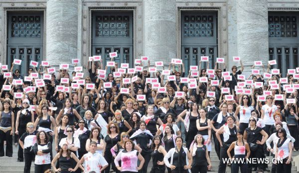 More than 500 women participate in a performance during the International Day for the Elimination of Violence against Women, on the stairs of the Parliament, in Montevideo, Uruguay&apos;s capital, on Nov. 25, 2010. [Xinhua]
