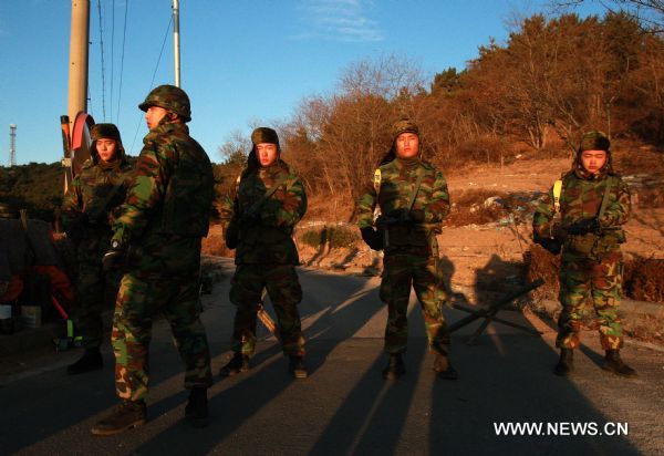 South Korean naval soldiers stand guard on the Yeonpyeong Island Nov. 26, 2010, after South Korea and the Democratic People&apos;s Republic of Korea (DPRK) exchanged artillery fires in waters off the west coast of the Korean Peninsula on Nov. 23. [Xinhua]