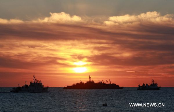 South Korean naval vessels sail near the Yeonpyeong Island Nov. 26, 2010, after South Korea and the Democratic People&apos;s Republic of Korea (DPRK) exchanged artillery fires in waters off the west coast of the Korean Peninsula on Nov. 23. [Xinhua]