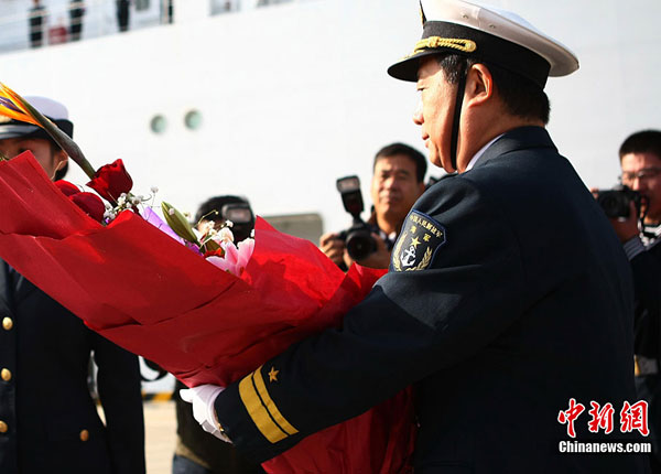 China's first hospital ship Daishandao, nicknamed 'Peace Ark', came home on Friday after treating thousands of people in Africa and South Asia in its maiden overseas medical mission.