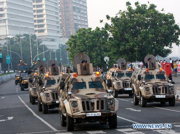 Indian Policemen parade during a memorial ceremony of the terrorist attacks in Mumbai, India, Nov. 26, 2010, the second anniversary of the attack. India on Friday held nationwide activities to mark the attack two years ago which killed 195 people and injured more than 300 others in Mumbai. [Xinhua]