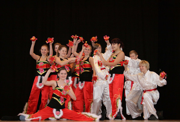 Students from the 6th to 9th grades of Niels Steensens Gymnasium perform Chinese folk dance 'Yanhe Wu', in Copenhagen, capital of Denmark, on Nov. 25, 2010, during the inauguration ceremony of Gymnasium's new Confucius Class. The establishment ceremony of Denmark's second Confucius class was held on Thursday in Copenhagen. [Devapriyo Das/Xinhua]