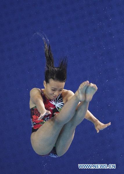 Choi Sut Ian of Macao of China competes during the women's 3m springboard final of Diving event at the 16th Asian Games in Guangzhou, south China's Guangdong Province, Nov. 26, 2010. Choi Sut Ian won the bronze medal of the event. (Xinhua/Fei Maohua)