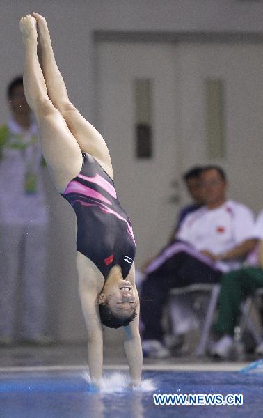 China's He Zi competes during the women's 3m springboard final of Diving event at the 16th Asian Games in Guangzhou, south China's Guangdong Province, Nov. 26, 2010. He Zi won the gold medal with 382.00 points. (Xinhua/Fei Maohua)