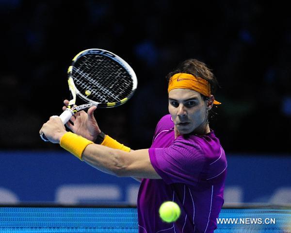 Rafael Nadal of Spain returns the ball during his match against Tomas Berdych of Czech Republic in 2010's ATP World Tour Finals in London, Britain, Nov. 26, 2010. Nadal won his third victory in a row by 2-0 to enter the semi-finals. [Zeng Yi/Xinhua]