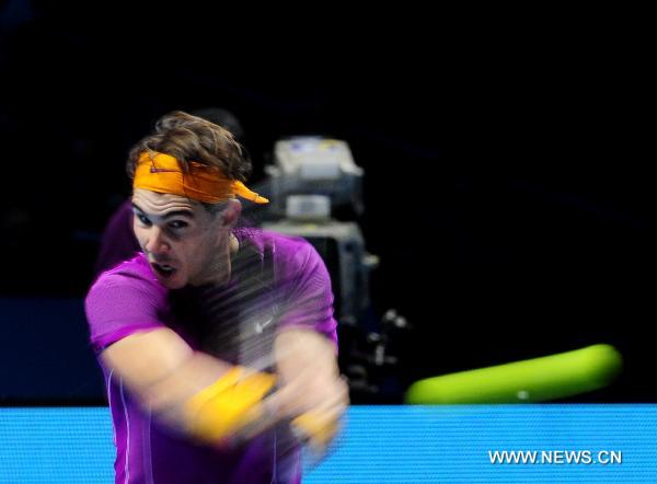 Rafael Nadal of Spain returns the ball during his match against Tomas Berdych of Czech Republic in 2010's ATP World Tour Finals in London, Britain, Nov. 26, 2010. Nadal won his third victory in a row by 2-0 to enter the semi-finals. [Zeng Yi/Xinhua]