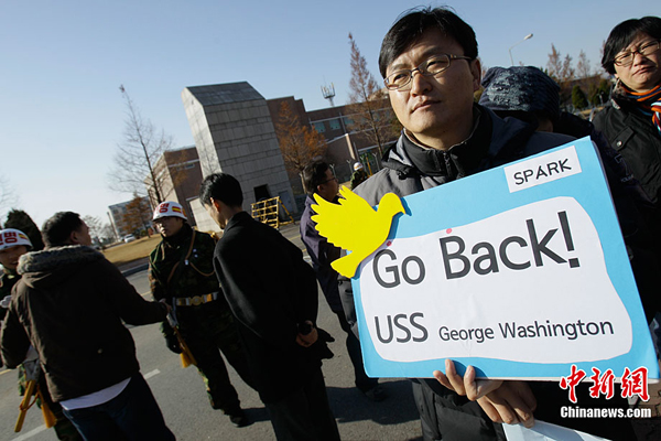 South Korean people held demonstrations before the U.S. military bases in South Korea on November 28 to denounce the U.S.-ROK joint naval drill in tense waters west of the divided Korean Peninsula. These people expressed opposition to the U.S. 'George Washington' aircraft carrier into South Korean territory and the joint naval drill with South Korean military. 