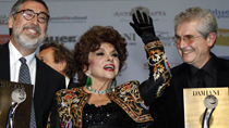 Film directors John Landis (L) of the U.S and Claude Lelouch (R) of France pose with Italian actress Gina Lollobrigida (C) after receiving an award in recognition of their career achievements at the 10th Monte-Carlo Film festival in Monaco November 27, 2010.