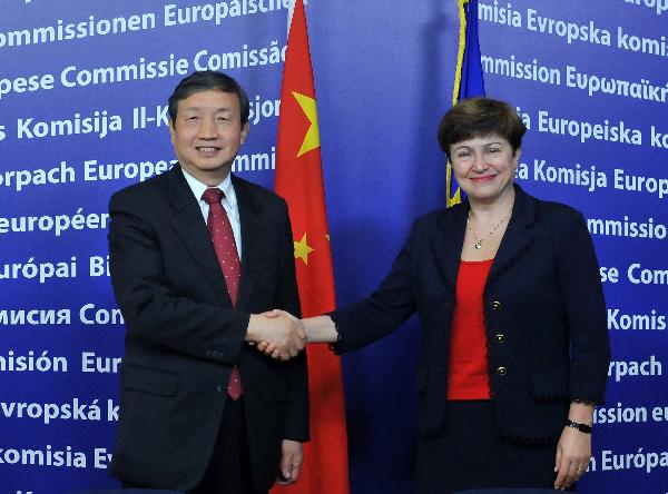 EU Commissioner for International Cooperation, Humanitarian Aid and Crisis Response Kristalina Georgieva (R) shakes hands with visiting Chinese State Councilor Ma Kai in Brussels, capital of Belgium, on Nov. 29, 2010. [Wu Wei/Xinhua] 