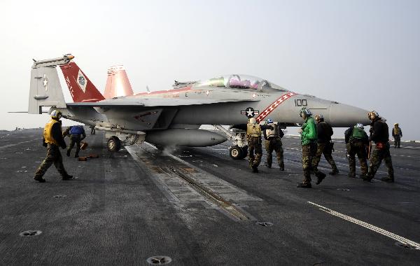  A jet fighter is about to take off from the aircraft carrier USS George Washington during a joint military exercise conducted by South Korea and the United States in tense waters west of the divided Korean Peninsula on Nov. 30, 2010. [Pool/Xinhua]