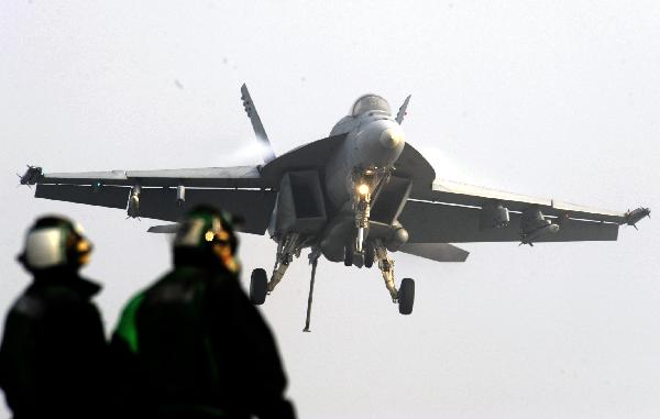 A jet fighter is seen in this picture taken on Nov. 30, 2010 aboard the aircraft carrier USS George Washington, during a joint military exercise conducted by South Korea and the United States in tense waters west of the divided Korean Peninsula. [Pool/Xinhua]
