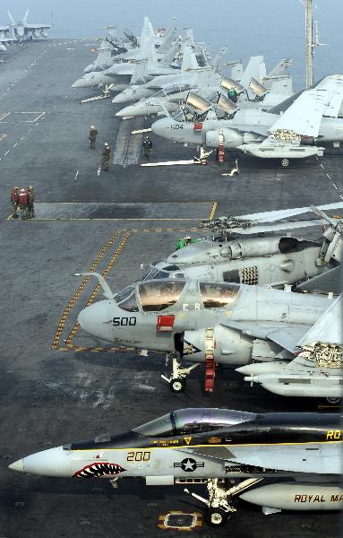 Jet fighters are pictured on the aircraft carrier USS George Washington during a joint military exercise conducted by South Korea and the United States in tense waters west of the divided Korean Peninsula on Nov. 30, 2010. [Pool/Xinhua]