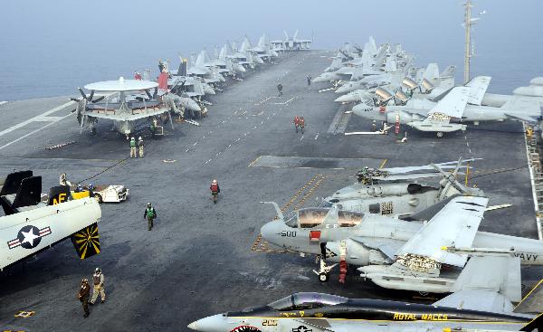 Jet fighters are pictured on the aircraft carrier USS George Washington during a joint military exercise conducted by South Korea and the United States in tense waters west of the divided Korean Peninsula on Nov. 30, 2010. [Pool/Xinhua]
