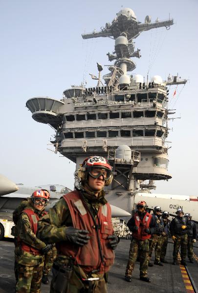 Soldiers are pictured on the aircraft carrier USS George Washington during a joint military exercise conducted by South Korea and the United States in tense waters west of the divided Korean Peninsula on Nov. 30, 2010. [Pool/Xinhua]