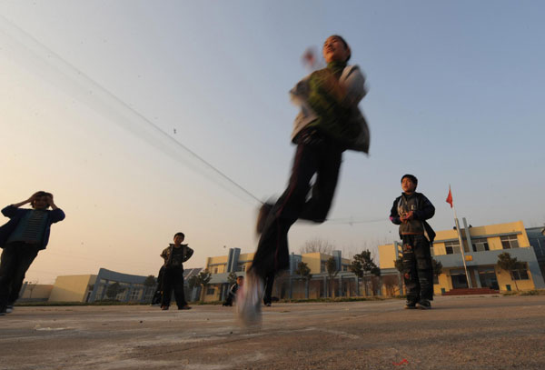 Students play during recess at a school in Shangcai county, Henan province on Nov 30, 2010. [Photo/Xinhua] 