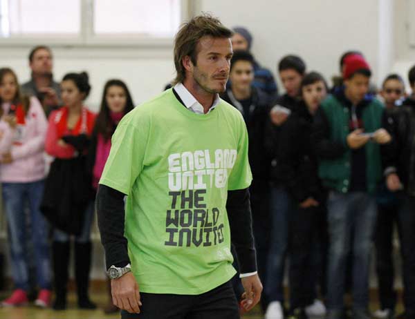 Soccer player David Beckham, a key ambassador to England's bid to stage the 2018 FIFA World Cup, visits a school, ahead of the 2018 and 2022 FIFA World Cup host announcement in Zurich November 30, 2010. (Xinhua/Reuters Photo)