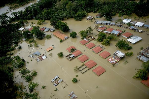 This image provided by the Venezuelan Government shows an aerial view of flooded areas in Barlovento, Miranda State, Venezuela, on Dec. 2, 2010. [Xinhua/Venezuelan Government]