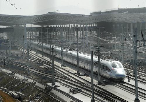 A train of China Railway High-Speed (CRH) is ready for a test running at a railway station in Xuzhou, east China&apos;s Jiangsu Province, Dec. 3, 2010. In September, the China-made CRH380A train hit a speed of 416.6 kilometers per hour on a test run to set a new world train speed record. It is expected to exceed the record at this test running, which will be held at a section of the Beijing-Shanghai High-Speed railway. [Xinhua]