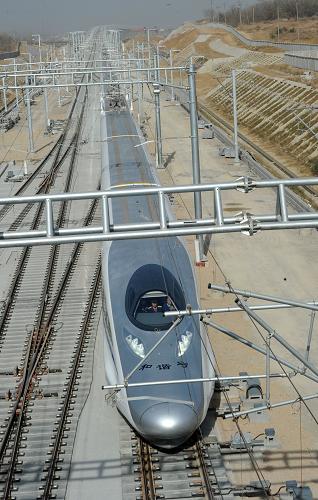 A train of China Railway High-Speed (CRH) is ready for a test running at a railway station in Xuzhou, east China&apos;s Jiangsu Province, Dec. 3, 2010. In September, the China-made CRH380A train hit a speed of 416.6 kilometers per hour on a test run to set a new world train speed record. It is expected to exceed the record at this test running, which will be held at a section of the Beijing-Shanghai High-Speed railway. [Xinhua]