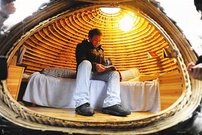 The egg-shaped house built by Dai Haifei, a 24-year-old Chinese graduate, is made of bamboo and nails. There is no room for other amenities besides a bed and a small water tank.