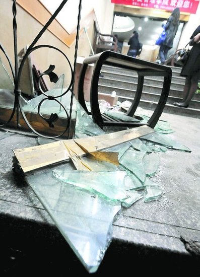 This photo shows a smashed window at the Youlian Hotel in Ningbo, Zhejiang Province on Wednesday.