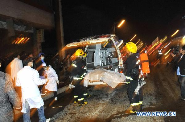 Rescuers and medical staff work on the explosion site of an Internet Cafe in downtown of Kaili City in Miao-Dong Autonomous Prefecture of Qiandongnan, southwest China's Guizhou Province, Dec. 4, 2010. Six people were killed and 37 others injured in an explosion that ripped through an Internet cafe at around 10:30 p.m. on Saturday, according to local police. (Xinhua/Chen Peiliang)