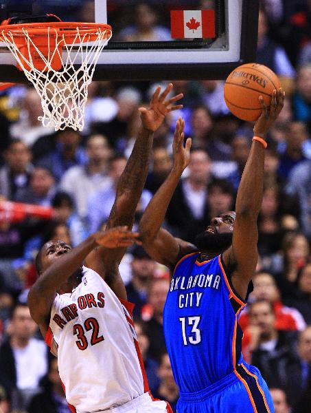 Oklahoma City Thunders' James Harden (R) jumps to shoot during the NBA game against Toronto Raptors at Air Canada Centre in Toronto, Canada, Dec. 3, 2010. Raptors won by 111-99. (Xinhua/Zou Zheng)