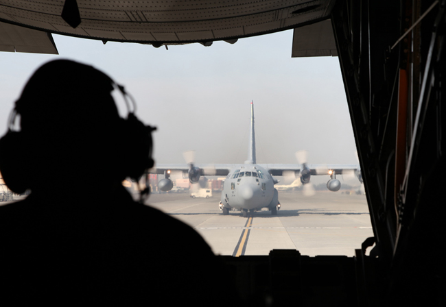 A C-130H Hercules transport aircraft is prepared to take off during a joint military drill in Japan, Dec. 6, 2010. Japan and the United States launched their a joint military exercise on Dec. 3. [Xinhua]