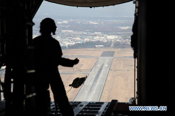 A pilot is seen on a C-130H Hercules transport aircraft during a joint military drill over the Sea of Japan, Dec. 6, 2010. Japan and the United States launched their a joint military exercise on Dec. 3.[Xinhua]