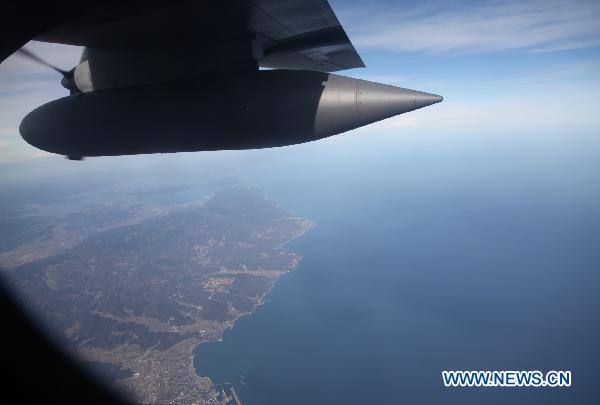 A C-130H Hercules transport aircraft fly over the Sea of Japan during a joint military drill, Dec. 6, 2010. Japan and the United States launched their a joint military exercise on Dec. 3. [Xinhua]