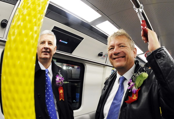 Guests at the launch ceremony visit the train in Changchun, Jilin Province, December 6. [Xinhua]