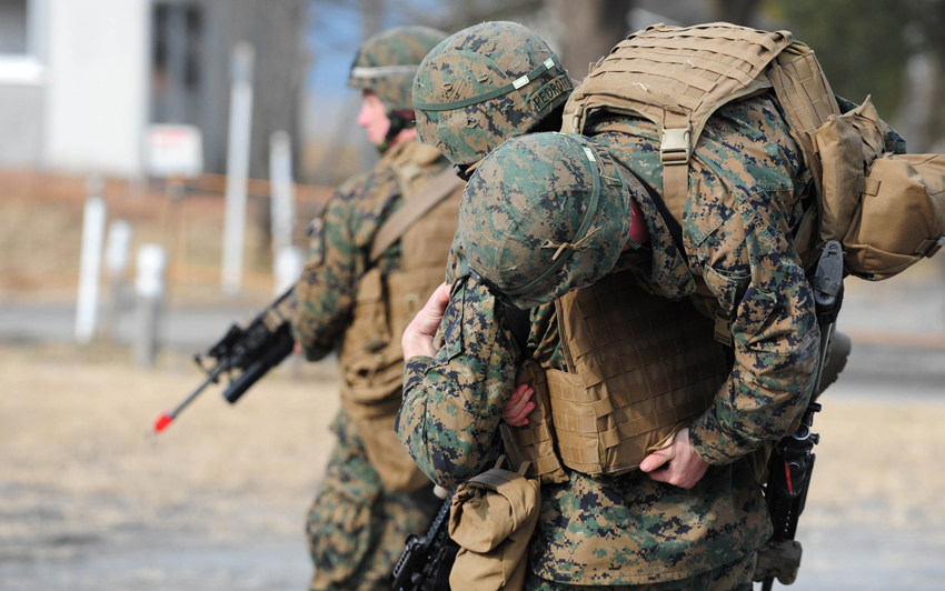 U.S. Marines carry mock wounded comrade during ground medical-aid training in Kirishima Training Area in southern Japan&apos;s Miyazaki Prefecture, Dec. 7, 2010. Japan and the United States launched a major ground training in Kirishima Training Area Tuesday, as part of the biggest-ever joint military exercises which kicked off in several places in Japan last Friday. [Xinhua]