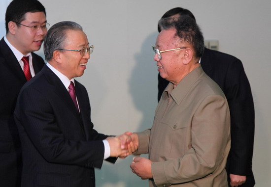 Kim Jong-il (R), top leader of the Democratic People's Republic of Korea (DPRK), shakes hands with visiting Chinese State Councilor Dai Bingguo in Pyongyang on Thursday Dec 9, 2010. [Xinhua]