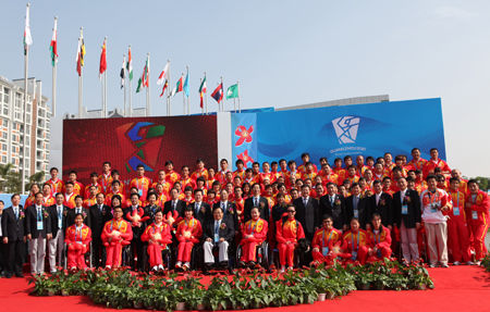 Officials and the Chinese sports delegation attending the opening ceremony of the Guangzhou 2010 Asian Para Games Athletes' Village 