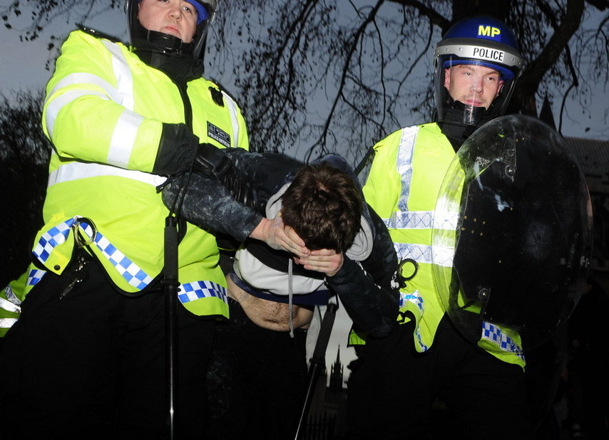 A protester is arrested in London, Britain, Dec. 9, 2010. [Xinhua]