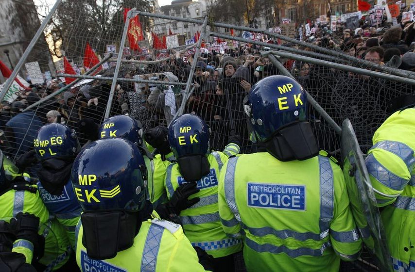 Over 20,000 students took to streets to protest against the coalition government&apos;s plan to raise the tuition fees cap in England from 3290 to 9,000 pounds per year, which was passed in the House of Commons Thursday, Dec. 9, 2010. More than a dozen of policemen and students have been injured during the clash. [Xinhua]