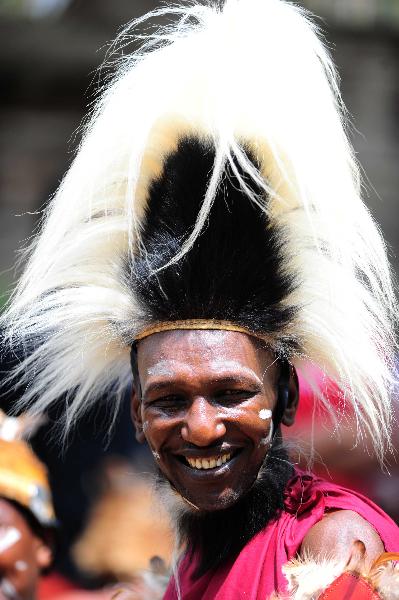 A man from an aboriginal tribe in Eastern Province of Kenya wears a headgear made of fur on Dec. 7, 2010. 42 aboriginal tribes in Kenya share the cultural diversity with their different kinds of headgears made of fur, feather and shells. [Xinhua]