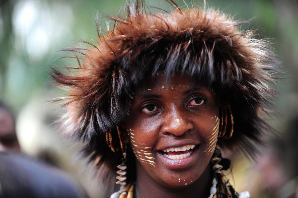  A woman from an aboriginal tribe in Eastern Province of Kenya wears a headgear made of fur on Dec. 7, 2010. 42 aboriginal tribes in Kenya share the cultural diversity with their different kinds of headgears made of fur, feather and shells. [Xinhua]