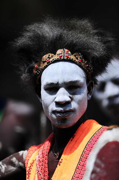 A man from an aboriginal tribe in Rift Valley Province of Kenya wears a headgear made of fur on Dec. 7, 2010. 42 aboriginal tribes in Kenya share the cultural diversity with their different kinds of headgears made of fur, feather and shells. [Xinhua] 