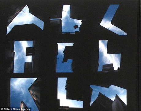 German photographer Lisa Rienermann, 30, spent half a year with her head in the clouds -- taking pictures of every letter of the alphabet in the spaces between buildings in Barcelona.